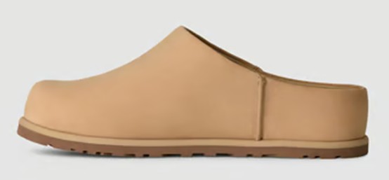 Single shoe of the Otzo Clog in light brown angled left